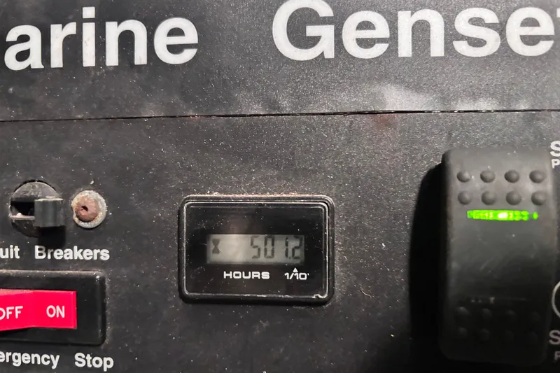 Slide: The Image of Control panel of a 2004 Cruisers Yachts 455 Express Motoryacht, showing 5012 hours. - 18