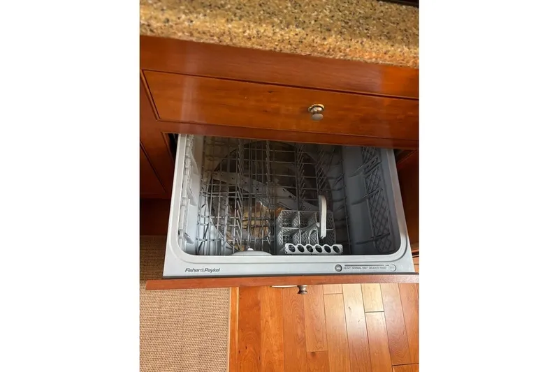 Slide: The Image of Open Fisher & Paykel dishwasher in 2004 Cruisers Yachts 455 Express Motoryacht kitchen. - 26