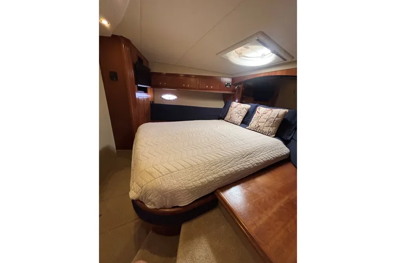 Slide: The Image of Luxurious bedroom interior of 2004 Cruisers Yachts 455 Express Motoryacht with cozy bedding. - 32