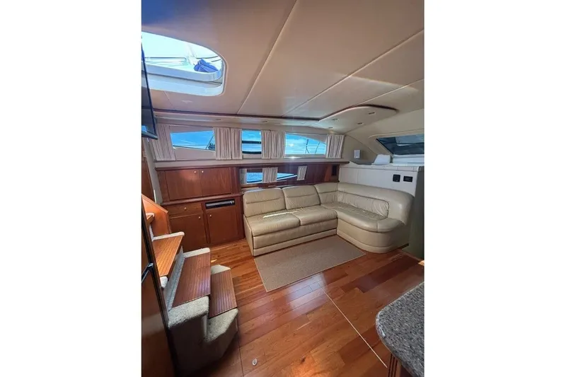 Slide: The Image of Luxurious interior of 2004 Cruisers Yachts 455 Express Motoryacht with leather seating and wood finishes. - 27