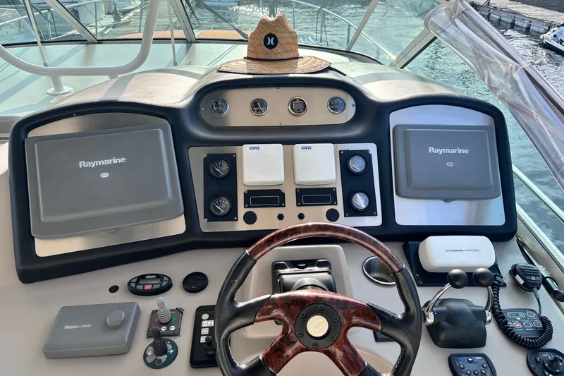 Slide: The Image of Helm of 2004 Cruisers Yachts 455 Express Motoryacht with Raymarine navigation systems. - 15