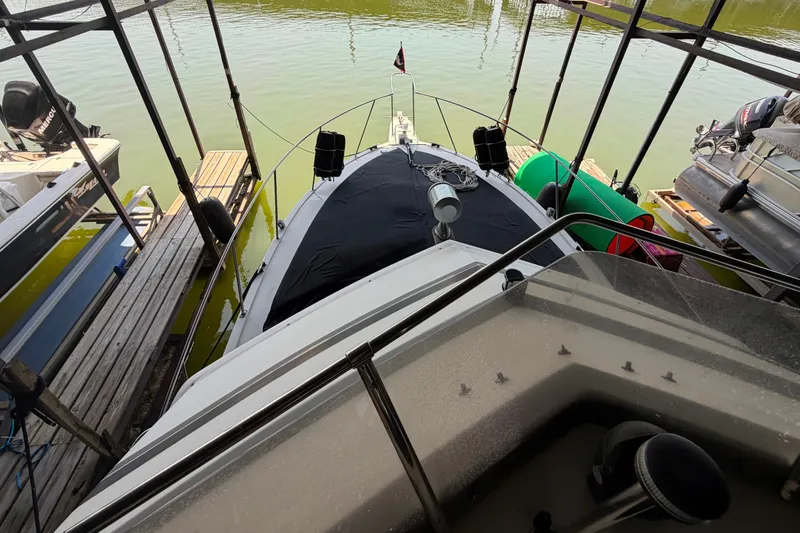 Slide: The Image of 1987 Carver 32 Aft Cabin Motor Yacht docked in a marina, viewed from above. - 17