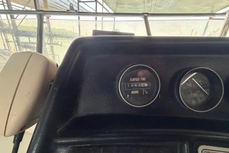 Slide: The Image of Dashboard of 1987 Carver 32 Aft Cabin Motor Yacht showing elapsed time and fuel gauges. - 13