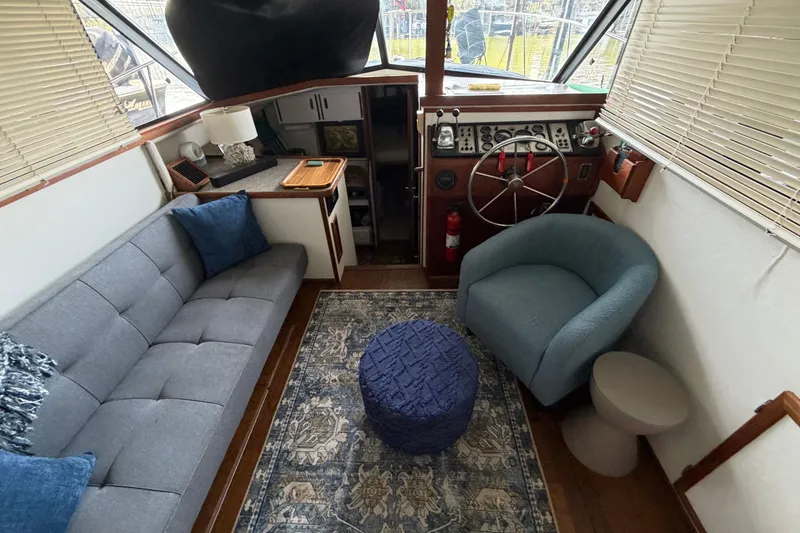 Slide: The Image of Interior of 1987 Carver 32 Aft Cabin Motor Yacht with cozy seating and helm. - 20