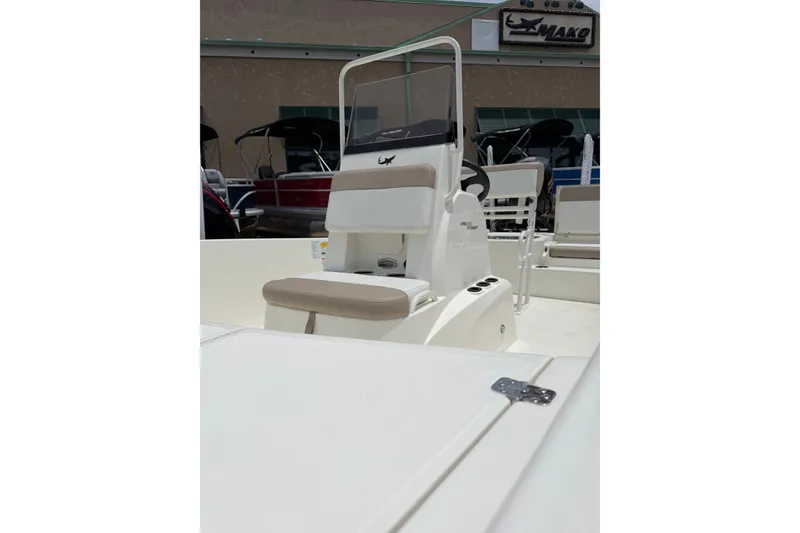 Slide: The Image of 2026 Mako Pro Skiff 19 CC boat interior with seating and console. - 2
