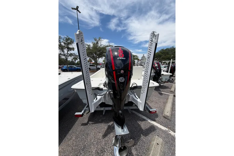 Slide: The Image of 2026 Mako Pro Skiff 19 CC with powerful 150 HP engine in parking lot. - 10