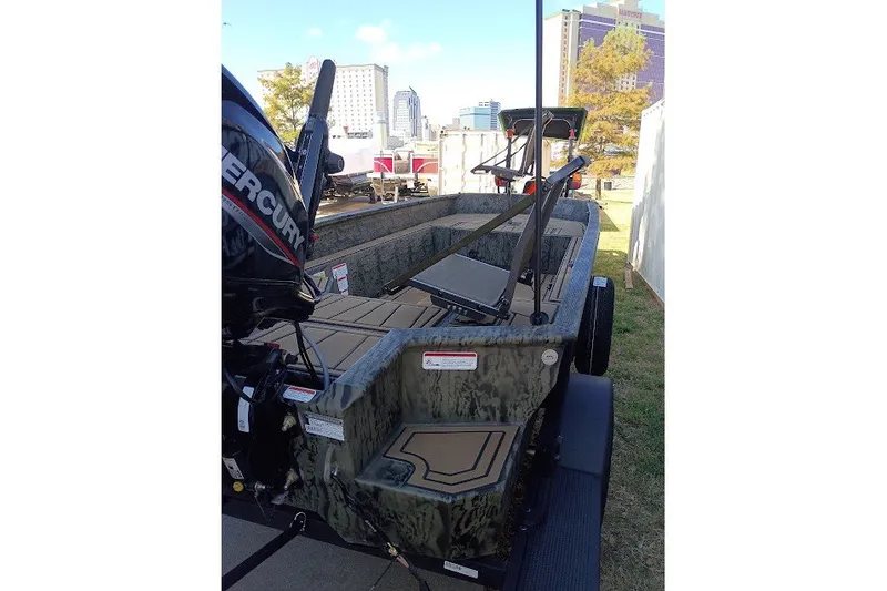 The Image of 2026 Tracker Grizzly 1650 T Prairie Wings Edition boat with Mercury engine, outdoor display. - 0