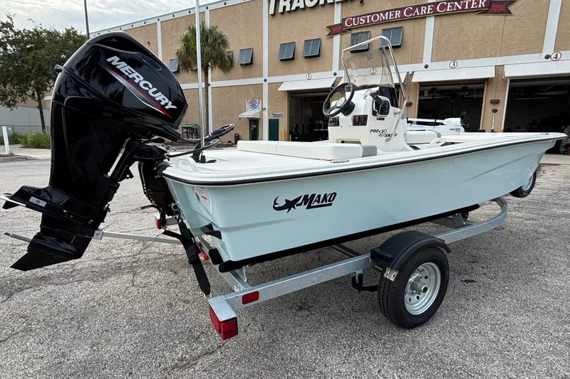 Slide: The Image of 2026 Mako Pro Skiff 13 CC boat on trailer, featuring Mercury outboard motor. - 5