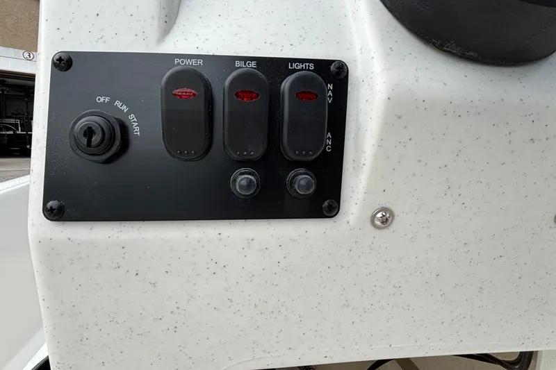 Slide: The Image of Control panel of 2026 Mako Pro Skiff 13 CC with switches for power, bilge, and lights. - 8