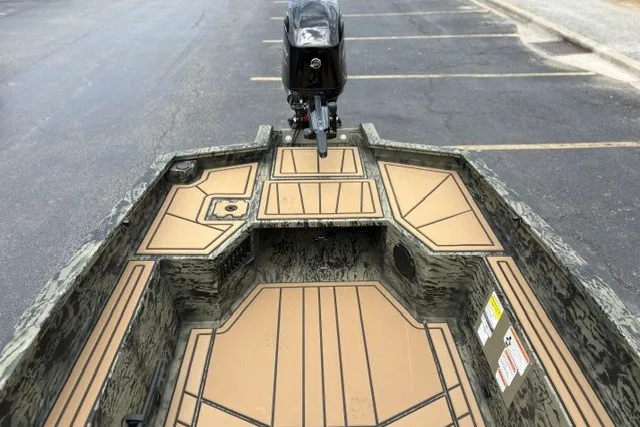 Slide: The Image of 2026 Tracker Grizzly 1650 T Prairie Wings Edition boat interior with camouflage design. - 14