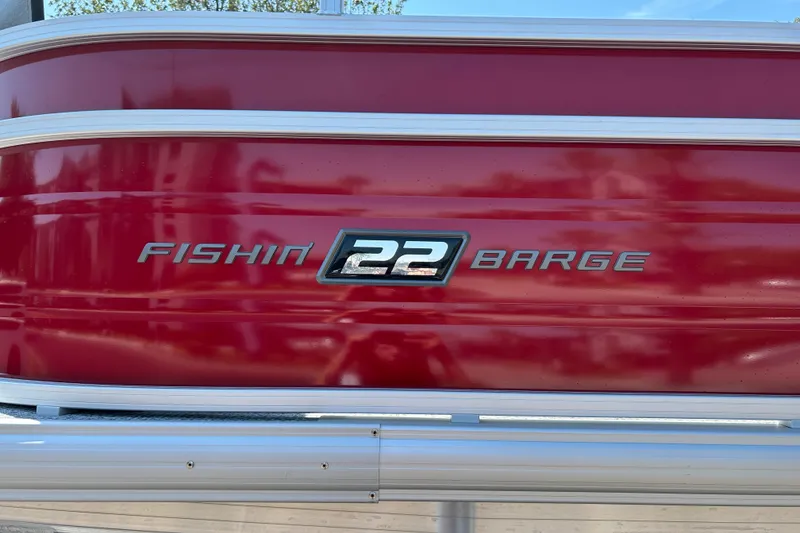 Slide: The Image of Red Sun Tracker Fishin' Barge 22 DLX, 2026 model, with silver lettering. - 34