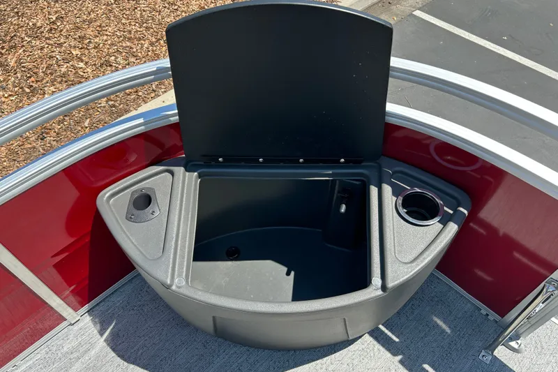 Slide: The Image of 2026 Sun Tracker Fishin' Barge 22 DLX livewell with cup holder and storage compartment. - 13