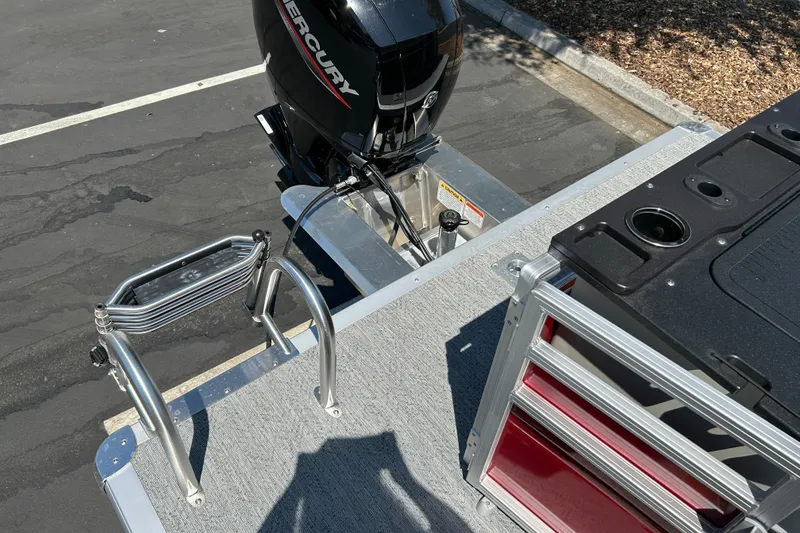 Slide: The Image of 2026 Sun Tracker Fishin' Barge 22 DLX with Mercury outboard motor and ladder. - 24