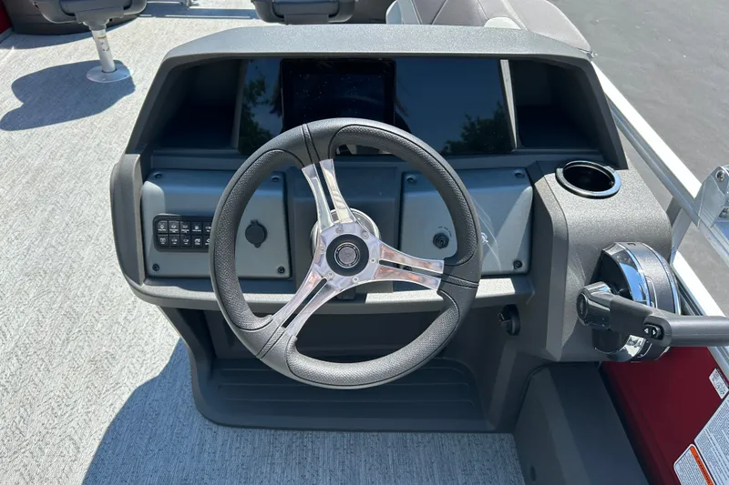Slide: The Image of Steering console of 2026 Sun Tracker Fishin' Barge 22 DLX pontoon boat. - 18