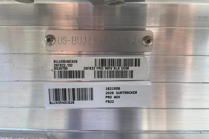 Slide: The Image of 2026 Sun Tracker Fishin' Barge 22 DLX identification plate with serial numbers and barcodes. - 125