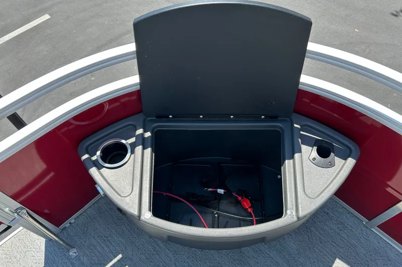 Slide: The Image of Open storage compartment on 2026 Sun Tracker Fishin' Barge 22 DLX pontoon boat. - 14