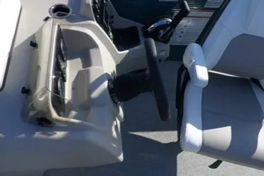 Slide: The Image of 2024 Princecraft Vectra 21 RL boat interior with steering wheel and seating. - 10
