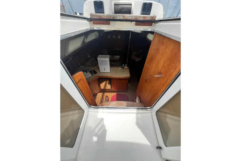 Slide: The Image of Interior view of 2007 Hunter 41 Deck Salon sailboat, featuring wooden cabinetry and compact layout. - 48