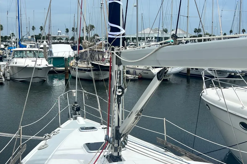 Slide: The Image of Hunter 41 Deck Salon 2007 sailboat docked in a marina with other boats. - 27