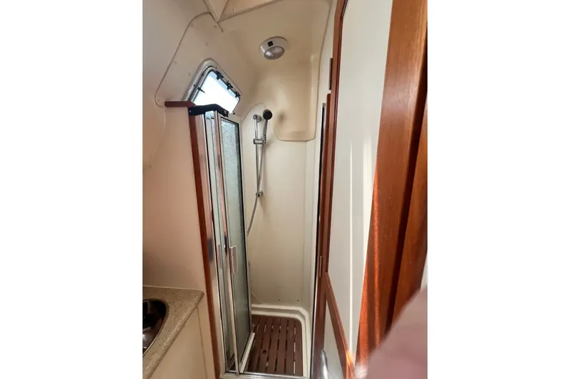 Slide: The Image of Compact shower area in 2007 Hunter 41 Deck Salon yacht bathroom. - 82