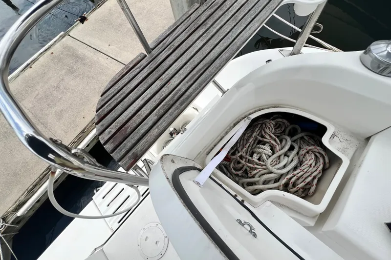 Slide: The Image of Storage compartment with ropes on a 2007 Hunter 41 Deck Salon sailboat. - 15