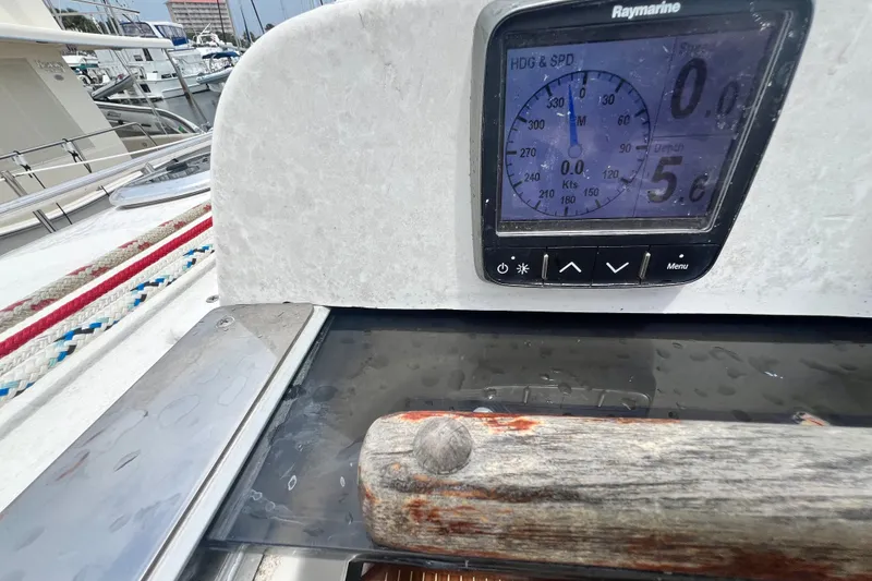Slide: The Image of Close-up of a 2007 Hunter 41 Deck Salon sailboat's navigation display and deck details. - 39