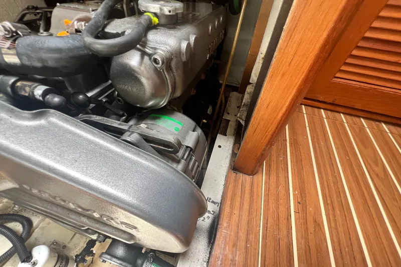 Slide: The Image of Engine compartment of a 2007 Hunter 41 Deck Salon sailboat, showcasing detailed components. - 89