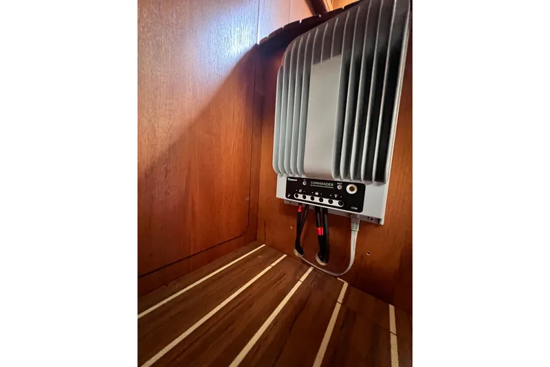 Slide: The Image of Electrical panel inside 2007 Hunter 41 Deck Salon yacht, mounted on wooden wall. - 97