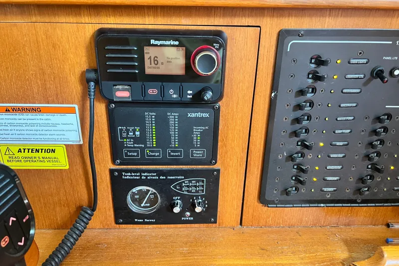 Slide: The Image of Control panel of a 2007 Hunter 41 Deck Salon sailboat with navigation and electrical systems. - 45