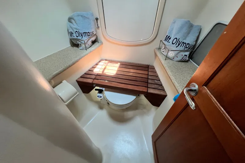 Slide: The Image of Bathroom interior of 2007 Hunter 41 Deck Salon yacht with wooden accents and towels. - 71