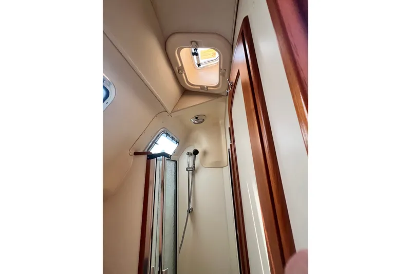 Slide: The Image of Interior view of 2007 Hunter 41 Deck Salon yacht bathroom with shower and hatch. - 81