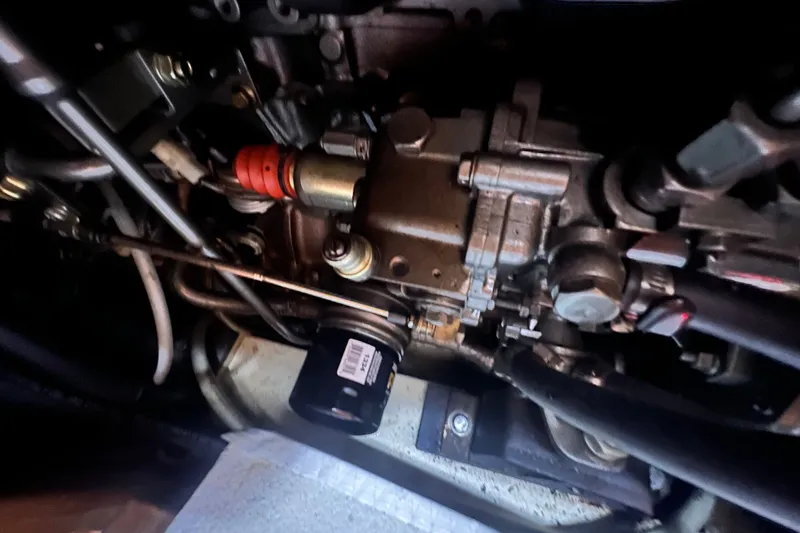 Slide: The Image of Engine components of a 2007 Hunter 41 Deck Salon sailboat, showcasing intricate mechanical details. - 91