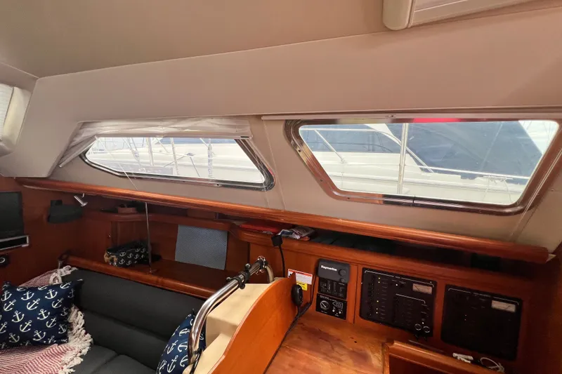 Slide: The Image of Interior of 2007 Hunter 41 Deck Salon yacht with windows and navigation equipment. - 49