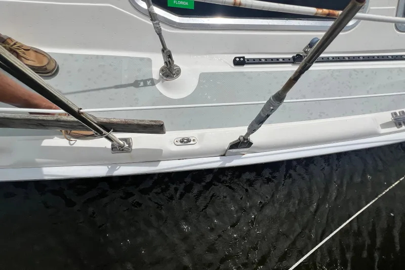 Slide: The Image of 2007 Hunter 41 Deck Salon sailboat deck with rigging and water view. - 32