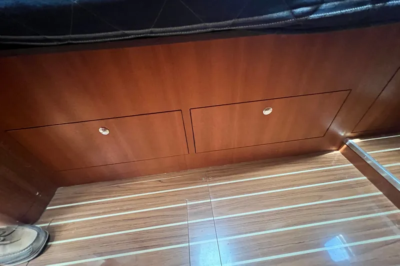 Slide: The Image of Wooden cabinetry and flooring inside a 2007 Hunter 41 Deck Salon yacht. - 69
