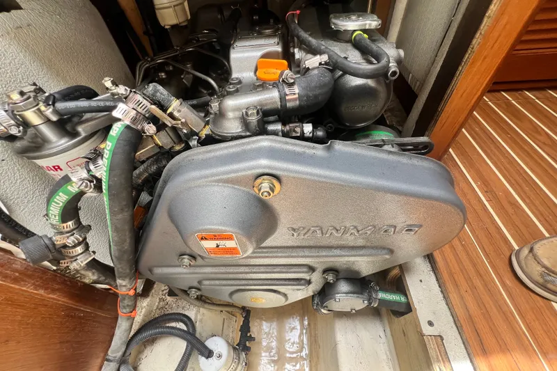 Slide: The Image of Engine compartment of a 2007 Hunter 41 Deck Salon sailboat with Yanmar engine. - 92