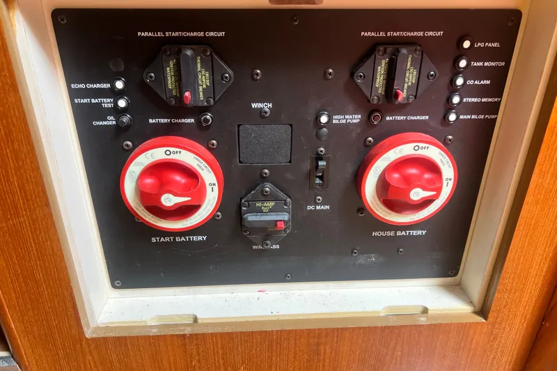 Slide: The Image of Control panel of a 2007 Hunter 41 Deck Salon sailboat, featuring battery switches. - 95