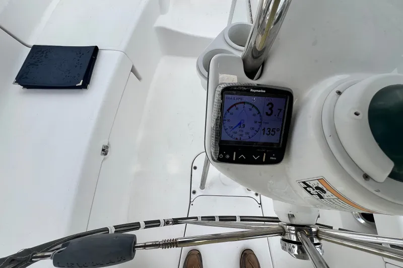 Slide: The Image of Cockpit view of 2007 Hunter 41 Deck Salon with navigation display and steering wheel. - 38