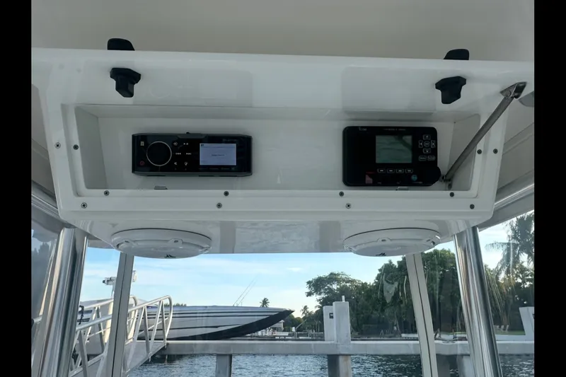 Slide: The Image of 2019 Albury Brothers 23 Forward Seating boat dashboard with electronic controls. - 27