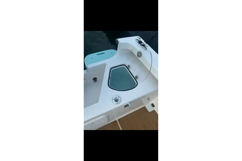 Slide: The Image of 2019 Albury Brothers 23 Forward Seating boat interior detail with storage compartment. - 13