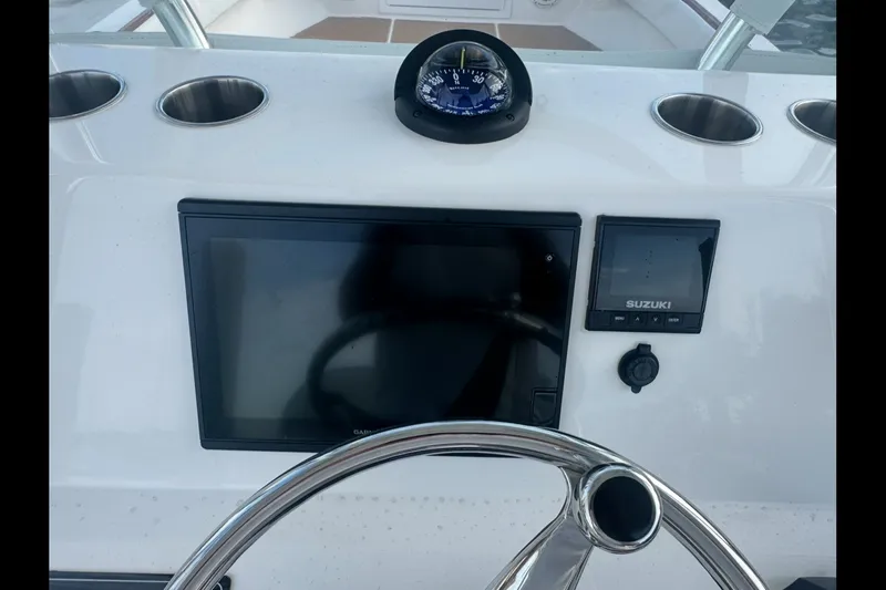 Slide: The Image of Control panel of 2019 Albury Brothers 23 Forward Seating boat with compass and displays. - 28