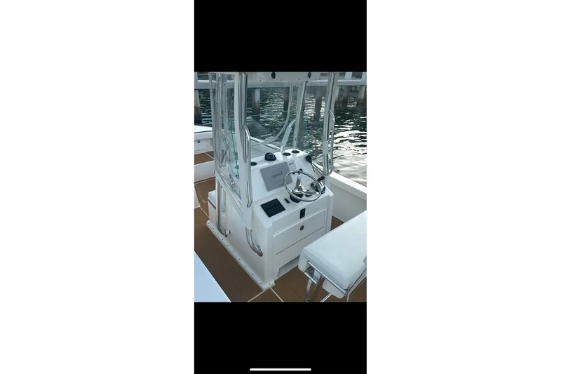 Slide: The Image of 2019 Albury Brothers 23 Forward Seating boat interior with steering console and seating. - 9