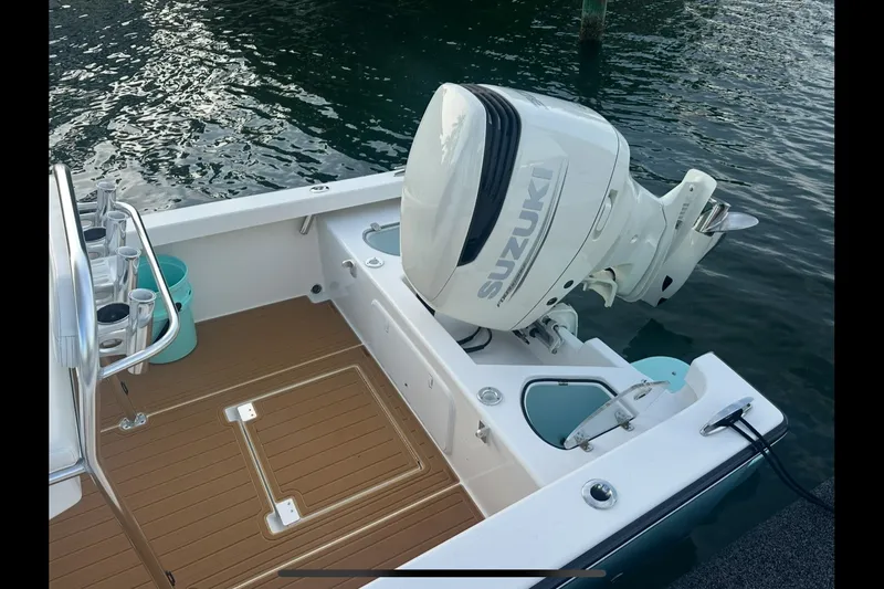 Slide: The Image of 2019 Albury Brothers 23 Forward Seating boat with Suzuki outboard motor on water. - 8