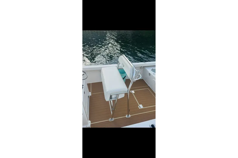 Slide: The Image of 2019 Albury Brothers 23 Forward Seating boat with white seating and teak flooring. - 10