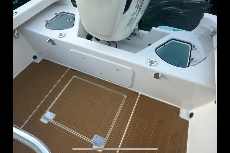 Slide: The Image of 2019 Albury Brothers 23 Forward Seating boat deck with storage compartments. - 24