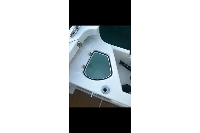 Slide: The Image of 2019 Albury Brothers 23 Forward Seating boat interior with storage compartment. - 14