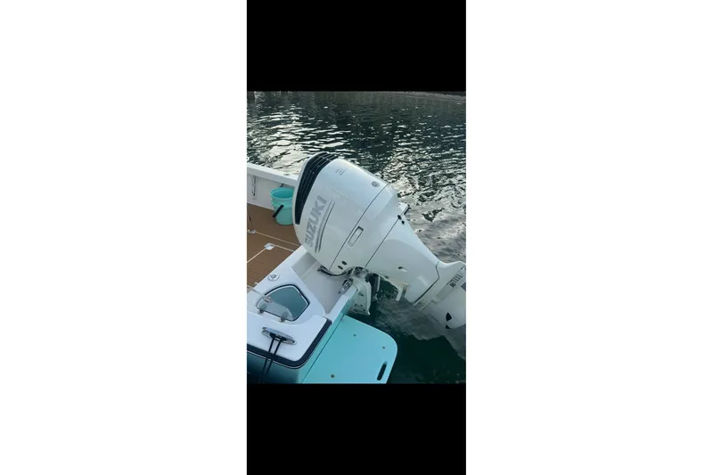 Slide: The Image of 2019 Albury Brothers 23 Forward Seating boat with Suzuki outboard motor on water. - 11