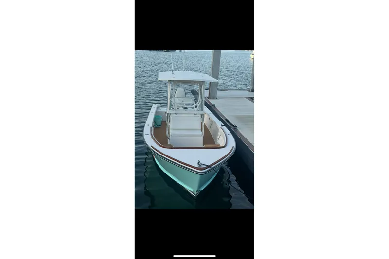 Slide: The Image of 2019 Albury Brothers 23 Forward Seating boat docked on calm water. - 5