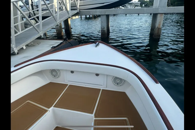 Slide: The Image of 2019 Albury Brothers 23 Forward Seating boat docked by the water. - 19