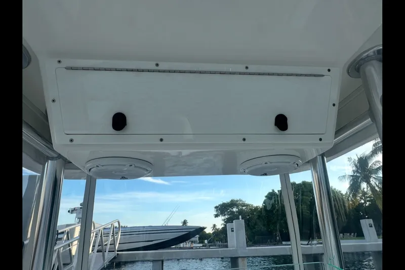 Slide: The Image of 2019 Albury Brothers 23 Forward Seating boat interior with overhead storage and scenic marina view. - 26
